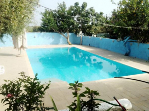 Гостиница Casa nell'agrumeto con piscina, Поццалло